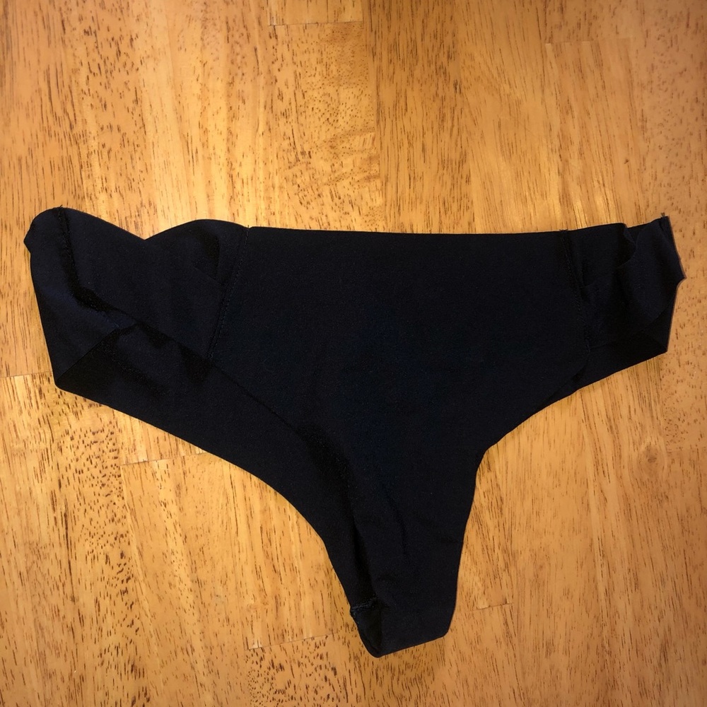 Victoria’s Secret no show thong panty. Never worn. Criss cross detail on hip.